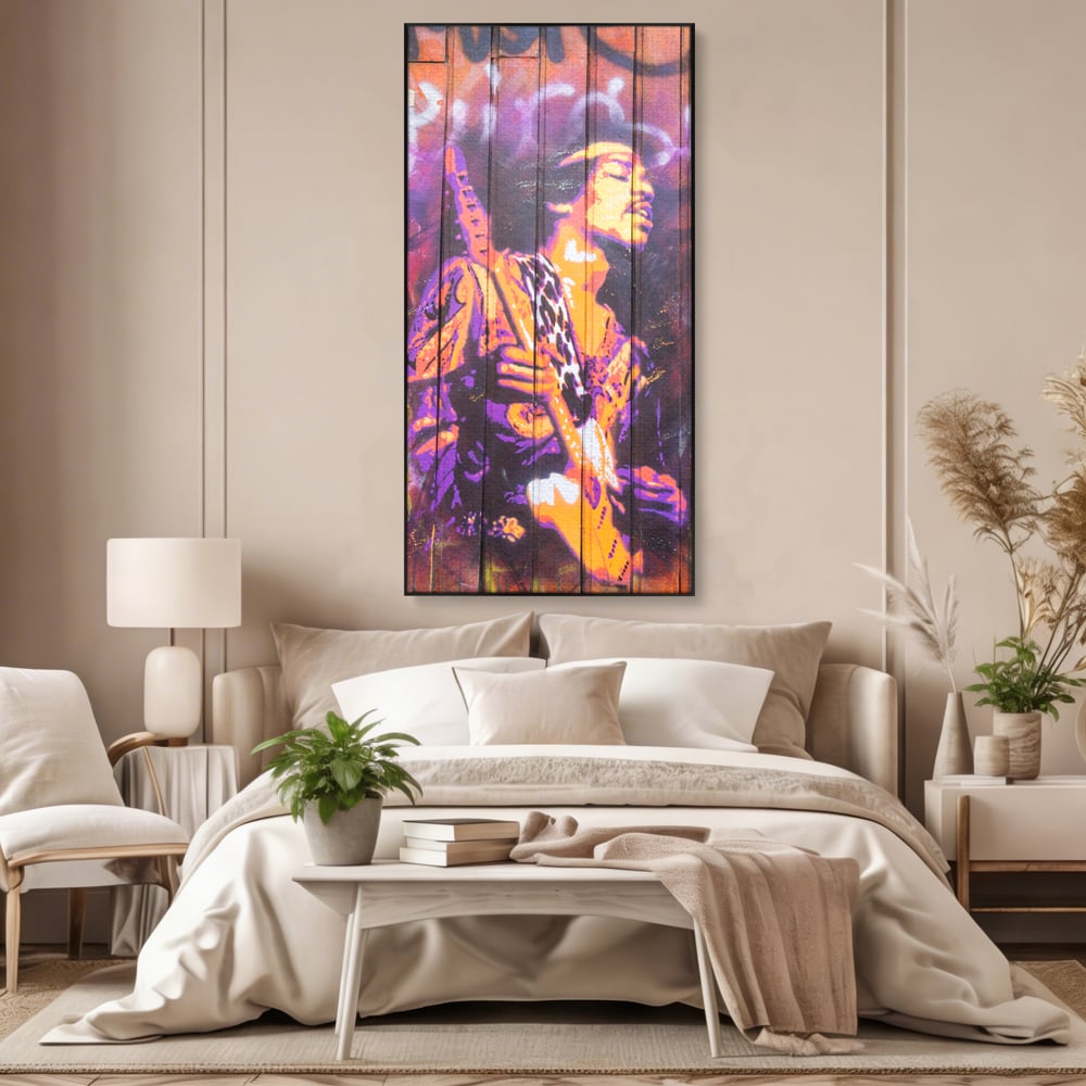 Tablou canvas cu tablou canvas cu jimi hendrix cantand la chitara, in rama de aluminiu negru, pe perete intr-un dormitor